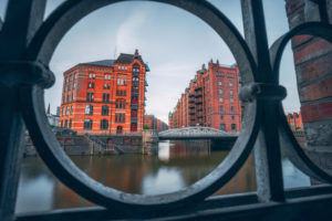 Historic warehouse district in Hamburg, Germany, Europe, old brick buildings and canal of the Hafencityviertel, UNESCO heritage Historic warehouse district in Hamburg, Germany, Europe, old brick buildings and canal of the Hafencityviertel, UNESCO heritage